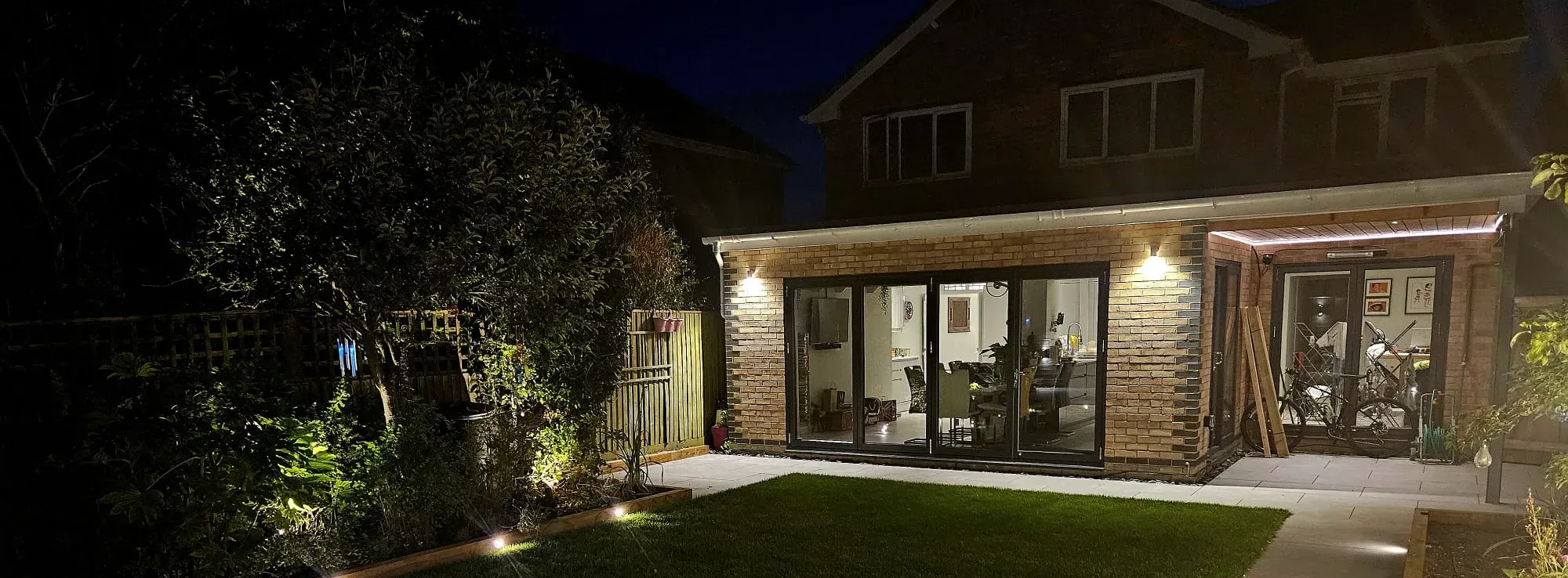 Well-lit property at night showcasing quality electrical services Oxfordshire, Berkshire, Wiltshire